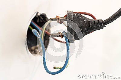 Badly wired plug showing bad and wrong and dangerous connection Stock Photo