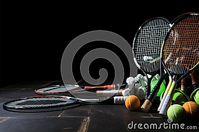 Badminton essentials on a black background, representing the concept of victory Stock Photo