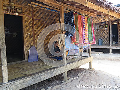 BADUY VILLAGE/INDONESIA - SEPTEMBER 27, 2014: Baduy women weaving traditional cloth Editorial Stock Photo
