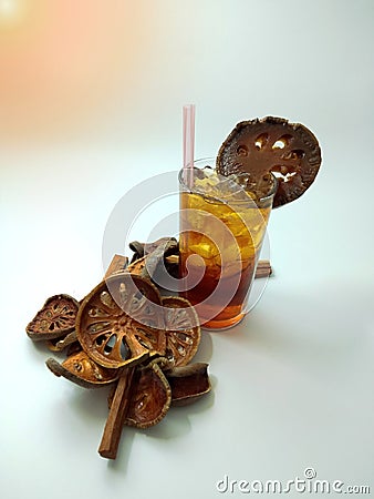 Bael cocktail with brown quince juice and ice in a glass Stock Photo