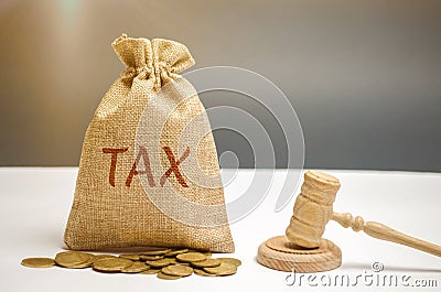 Bag of money and the word Tax and hammer of the judge. Law concept. Court and judgment. Justice and legality. Legislators, public Stock Photo