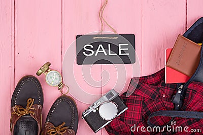 bag, passport, camera, compass, shoes, shirt, note pad and blackboard with text & x22;Sale& x22; Stock Photo