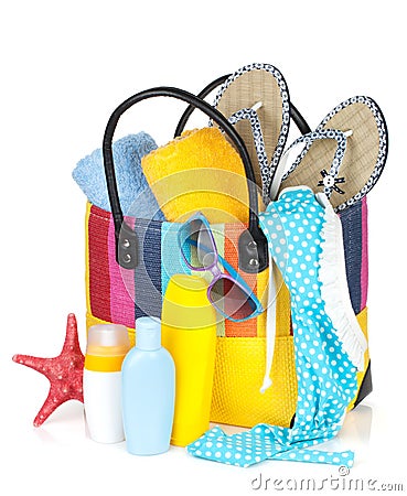 Bag with towels, sunglasses, flip-flops and beach items Stock Photo