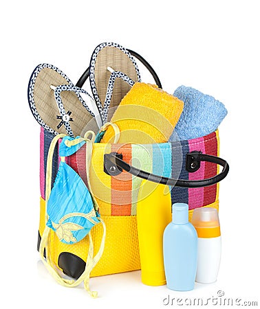 Bag with towels, sunglasses, flip-flops and beach items Stock Photo