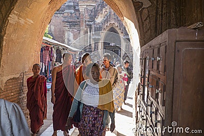 Burmese monks entering a Buddhist temple in Bagan Editorial Stock Photo