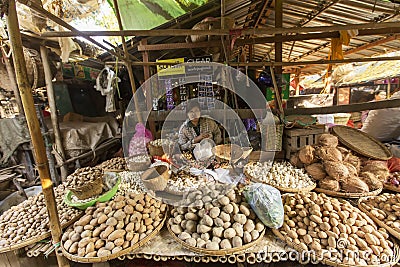 BAGAN, MYANMAR: FEBRUARY 21, 2015 : Local women sell their produce at an outdoor market in Bagan on February 21, 2015. The market Editorial Stock Photo