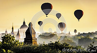Bagan Pagoda and Tourist Balloons in the morning mist , Bagan, Myanmar Stock Photo