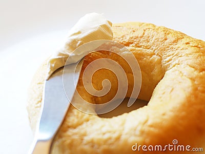 Bagel, knife, and cream cheese Stock Photo