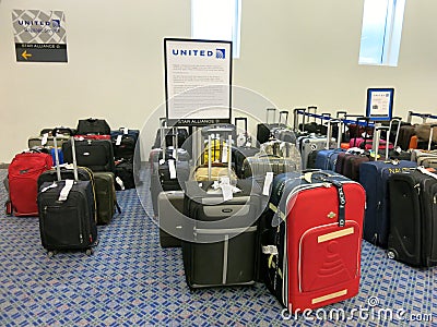 Baggage Laid Out at Airline Luggage Counter After Flight Delayed -- Many flights have been delayed in winter, causing luggage to Editorial Stock Photo