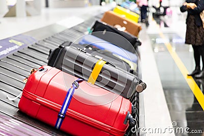 Baggage luggage on conveyor carousel belt at airport arrival Stock Photo