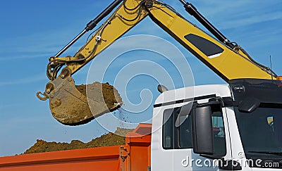 Excavator loads truck Stock Photo