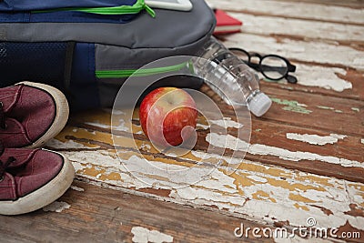 Bagpack, water bottle, apple, shoes and spectacle Stock Photo