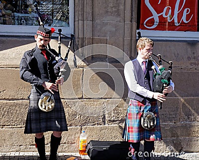 Bagpipe players in a street of Edinburgh - Scotland Editorial Stock Photo