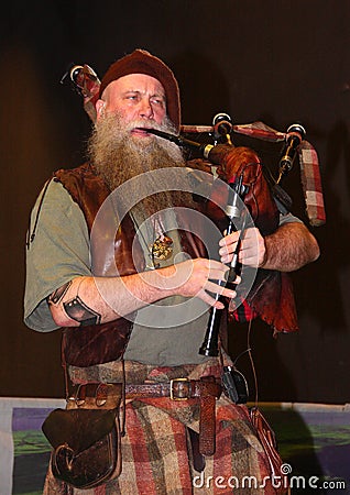 Bagpiper from the Saor Patrol group Editorial Stock Photo