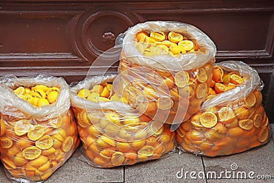 Bags full Peels of oranges, Waste after squeezing orange juice Stock Photo