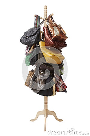 Bags hanging on coat rack Stock Photo