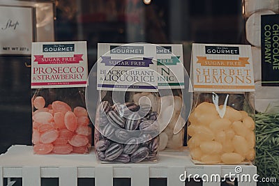 Bags of retro sweets on display in shop window in Cotswolds, UK Editorial Stock Photo