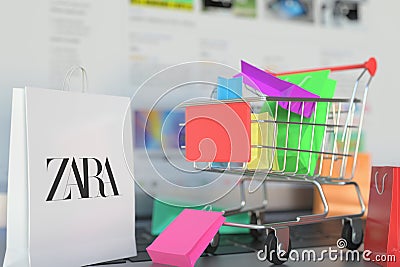 Bag with Zara logo and shopping cart on a laptop keyboard. Editorial online shopping related 3D rendering Editorial Stock Photo