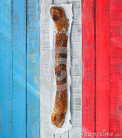 Baguette over a table with the colors of France flag. Stock Photo