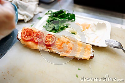 Baguette with salmon in the cooking process Stock Photo