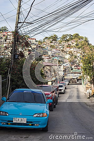 Baguio City, Philippines - An old Honda City car parked along Dr. Carino Street. A residential area in Baguio Editorial Stock Photo