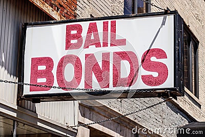 Bail Bonds sign chained to a building I Stock Photo