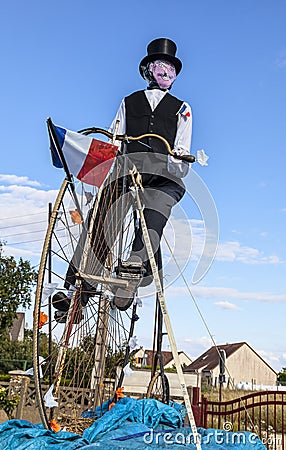 Mascot of a Retro Cyclist During Le Tour de France. Editorial Stock Photo