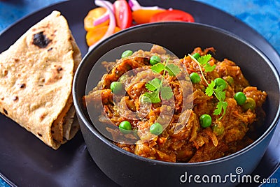 Indian meal-Baingan Bharta with roti and salad Stock Photo