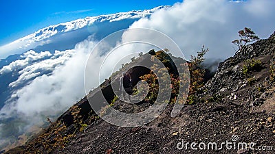 Bajawa - A girl going down the volcano Inierie Stock Photo