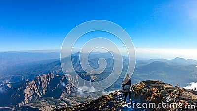 Bajawa - A girl going down the volcano Inierie Stock Photo