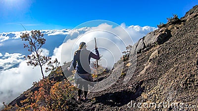 Bajawa - A girl going down the volcano Inierie Stock Photo