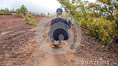 Bajawa - A girl going down the volcano Inierie Stock Photo