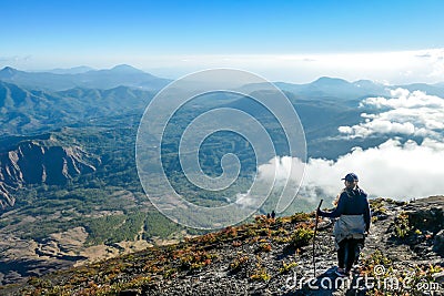 Bajawa - A girl going down the volcano Inierie Stock Photo