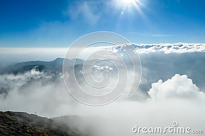 Bajawa - Sun shining above the clouds Stock Photo