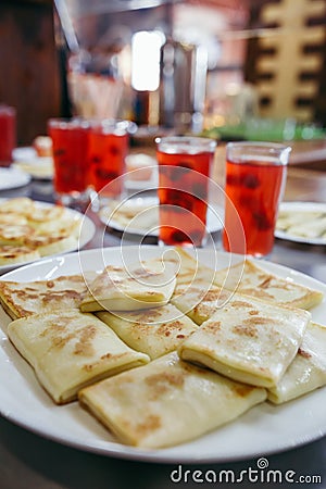 Baked apple served with pancakes and juice Stock Photo