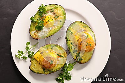 Baked avocado and egg Stock Photo