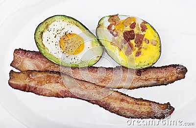 Baked avocado with eggs , cheese and bacon Stock Photo