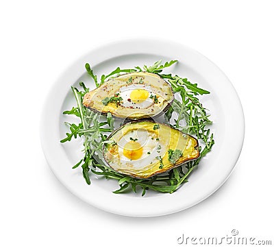 Baked avocado with eggs on white background Stock Photo