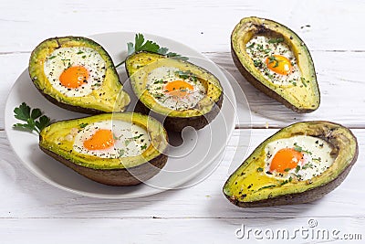 Baked avocado with eggs Stock Photo