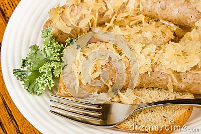 Baked bratwurst with sauerkraut Stock Photo