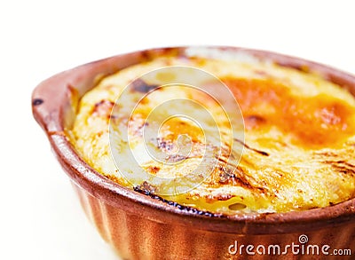 Baked cheese pasta served in a clay pot Stock Photo