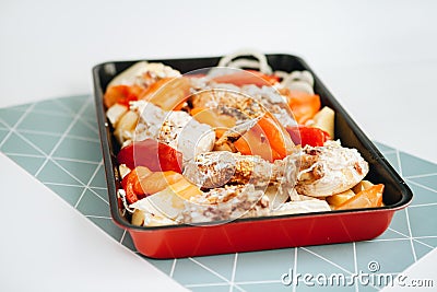 Baked chicken with vegetables and mayonnaise Stock Photo