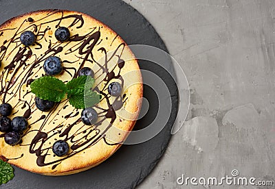 Baked curd casserole on a black plate, top view, tasty and healthy dessert Stock Photo