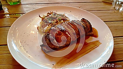 Baked duck on a white plate, sliced Stock Photo