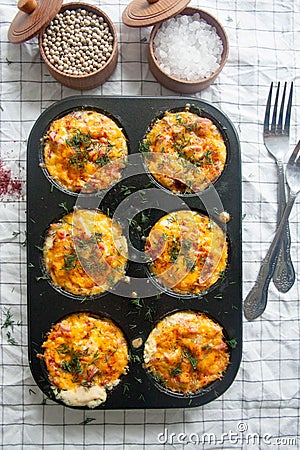 Baked eggs with sausage, cheese and dill Stock Photo