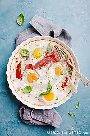 Baked eggs shakshouka in baked form Stock Photo