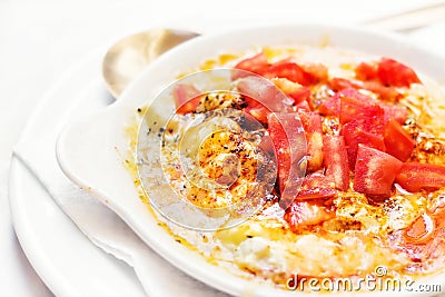 Baked feta cheese with tomatoes Stock Photo