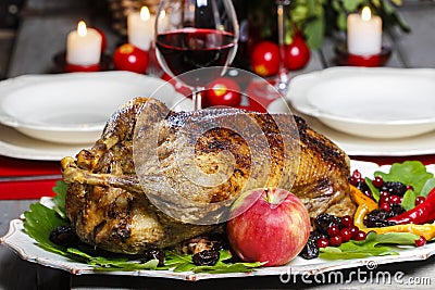 Baked goose on wooden table Stock Photo