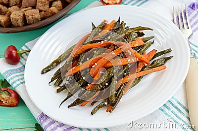 Baked green beans and carrots - vegan diets Stock Photo