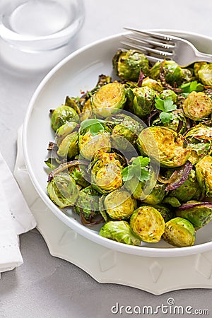 Baked Green Brussels Sprouts with honey and Parmesan cheese Stock Photo